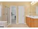 Bathroom featuring a glass shower, single sink, and walk in closet at 4424 Bellwood Cir, Atlanta, GA 30349