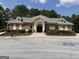 Brick clubhouse with well manicured landscaping at 4424 Bellwood Cir, Atlanta, GA 30349