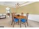 Traditional dining room with wood table, upholstered chairs, and chandelier at 4424 Bellwood Cir, Atlanta, GA 30349