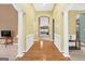 Bright foyer featuring hardwood floors, archways, and decorative white molding, leading to other rooms at 4424 Bellwood Cir, Atlanta, GA 30349