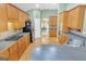 Open kitchen with stainless steel appliances and view to dining area at 4424 Bellwood Cir, Atlanta, GA 30349