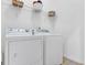 Laundry room with a washer and dryer, and white walls at 4424 Bellwood Cir, Atlanta, GA 30349