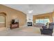 Cozy living room with a fireplace, neutral carpet, and natural light at 4424 Bellwood Cir, Atlanta, GA 30349
