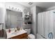 Clean bathroom with a vanity, mirror, and shower, fitted with essential amenities at 2783 Parkway Cv, Lithonia, GA 30058
