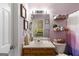 Practical bathroom with a vanity, mirror, and shower, designed for everyday use at 2783 Parkway Cv, Lithonia, GA 30058
