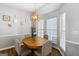 Cozy dining area with natural light and a stylish pendant light fixture above the table at 2783 Parkway Cv, Lithonia, GA 30058