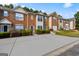 Attractive brick townhomes feature well-manicured lawns and spacious driveways for convenient parking at 2783 Parkway Cv, Lithonia, GA 30058