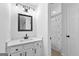 Clean bathroom with white vanity and updated fixtures at 4392 Lower Fayetteville Rd, Sharpsburg, GA 30277