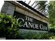 Close-up of The Canoe Club community entrance sign at 140 Dockside Dr # 381, Fayetteville, GA 30215