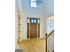 Two-story entryway with hardwood floors and a wooden front door at 140 Dockside Dr # 381, Fayetteville, GA 30215
