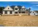 Two-story house with gray siding, stone accents, and a covered porch at 140 Dockside Dr # 381, Fayetteville, GA 30215