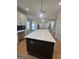Kitchen island with white quartz countertop at 140 Dockside Dr # 381, Fayetteville, GA 30215