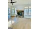 Living room with hardwood floors, stone fireplace, and large windows at 140 Dockside Dr # 381, Fayetteville, GA 30215