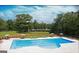 Community lap pool with lounge chairs and umbrellas at 140 Dockside Dr # 381, Fayetteville, GA 30215