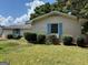 A single-story white brick home with light blue shutters and green bushes at 2071 Twin Falls Rd, Decatur, GA 30032