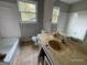 The bathroom features a combination tub and shower, along with a vanity and tile flooring at 2177 E Chester Cir, Conyers, GA 30013