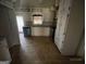 Kitchen features tile flooring, white cabinets, and modern appliances at 2177 E Chester Cir, Conyers, GA 30013