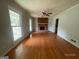 Spacious living room with hardwood floors and a cozy fireplace at 2177 E Chester Cir, Conyers, GA 30013