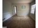 A bright room with tiled floors, a large window, and decorative wall accents at 2177 E Chester Cir, Conyers, GA 30013