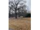 Large backyard with mature trees and grassy area at 1862 Old Conyers Rd, Stockbridge, GA 30281