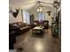 Cozy living room featuring hardwood floors, leather sofas, and a rustic coffee table at 225 Euharlee Five Forks Rd, Kingston, GA 30145