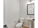 A clean powder room with a pedestal sink and decorative mirror offering practicality and style at 527 Bohannon Rd # 12, Grantville, GA 30220