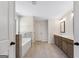 Bathroom offers a tub, separate tiled shower, and double sink vanity with excellent lighting at 527 Bohannon Rd # 12, Grantville, GA 30220