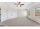 Neutral bedroom showcasing double closets, a window with bright light and soft carpeting at 527 Bohannon Rd # 12, Grantville, GA 30220