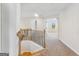 Bright hallway leads to a bedroom, featuring natural light and neutral paint for a modern feel at 527 Bohannon Rd # 12, Grantville, GA 30220