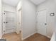 Hallway displaying access to rooms and the neutral paint, creating a seamless flow throughout the home at 527 Bohannon Rd # 12, Grantville, GA 30220