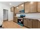 Bright kitchen featuring granite countertops, stainless steel appliances, and wooden cabinets at 527 Bohannon Rd # 12, Grantville, GA 30220