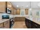 Modern kitchen featuring granite countertops, stainless steel appliances, and a kitchen island at 527 Bohannon Rd # 12, Grantville, GA 30220