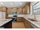 Bright kitchen featuring granite countertops, stainless steel appliances, and wooden cabinets at 527 Bohannon Rd # 12, Grantville, GA 30220