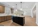 An open-concept kitchen showcases granite counters, an island, stainless steel appliances, and lots of natural light at 527 Bohannon Rd # 12, Grantville, GA 30220