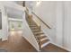 Bright foyer with a staircase featuring wood treads and black metal balusters at 527 Bohannon Rd # 12, Grantville, GA 30220