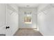 Walk-in closet complete with shelving and natural light, providing ample space and organization for your wardrobe needs at 527 Bohannon Rd # 12, Grantville, GA 30220