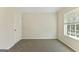 Bedroom with neutral walls, carpet, and a window at 515 Bohannon Rd # 13, Grantville, GA 30220