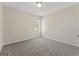 This bedroom has neutral walls and carpet with a window providing natural light at 515 Bohannon Rd # 13, Grantville, GA 30220