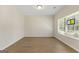 Well-lit bedroom with hardwood floors and a window offering natural light at 515 Bohannon Rd # 13, Grantville, GA 30220