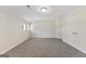 This carpeted bedroom has neutral walls with two windows providing natural light at 515 Bohannon Rd # 13, Grantville, GA 30220