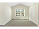 Carpeted bedroom features natural light from the window at 515 Bohannon Rd # 13, Grantville, GA 30220