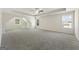 Spacious bedroom featuring neutral walls and carpet, tray ceiling, and natural light from multiple windows at 515 Bohannon Rd # 13, Grantville, GA 30220