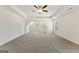 Spacious bedroom featuring neutral walls and carpet, tray ceiling with fan, and natural light from multiple windows at 515 Bohannon Rd # 13, Grantville, GA 30220