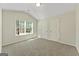 Carpeted bedroom features two doors and a window at 515 Bohannon Rd # 13, Grantville, GA 30220