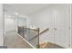 Upstairs hallway with wood and black metal railing at 515 Bohannon Rd # 13, Grantville, GA 30220
