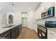 Kitchen view featuring white cabinets, stainless steel appliances, granite countertops and hardwood floors at 515 Bohannon Rd # 13, Grantville, GA 30220