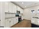 Kitchen featuring white cabinets, stainless steel appliances, granite countertops and hardwood floors at 515 Bohannon Rd # 13, Grantville, GA 30220