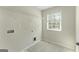 Tile laundry room with washer hookups and a window at 515 Bohannon Rd # 13, Grantville, GA 30220