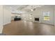 Open concept living room flows into kitchen, features hardwood floors and fireplace at 515 Bohannon Rd # 13, Grantville, GA 30220