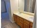 Bathroom with double vanity and wood cabinets at 2570 Picardy N Cir # B, Atlanta, GA 30349